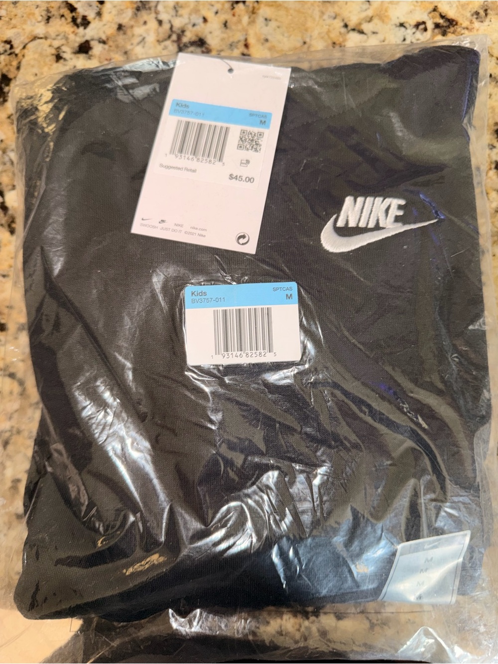 Nike Kids Black Hoodie with White Swoosh Logo